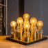 Batch 112: Sunday - Lustre / luminaire made of golden metal containing nine lighting points with domes in translucent molded glass, featured. Auction Design / Flávia Cardoso Soares Auctions. Photo: Disclosure.